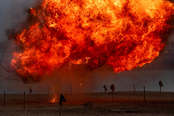 Explosion of explosives, large fire.