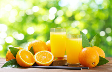 glasses of fresh orange juice with fresh fruits - 767909948