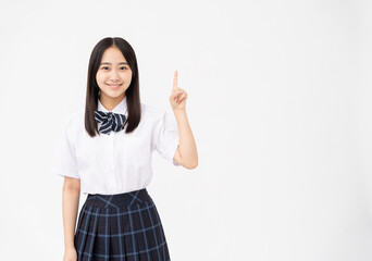制服を着た日本人女子高校生のポートーレート/指差し/白背景スタジオ撮影	
 - obrazy, fototapety, plakaty