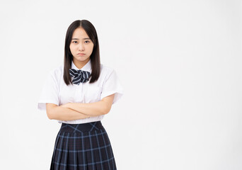 制服を着た日本人女子高校生/悩んでいる/白背景スタジオ撮影	