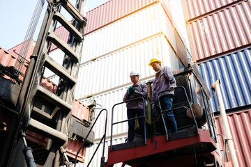 Engineers and employees work at shipping containers or shipping containers.