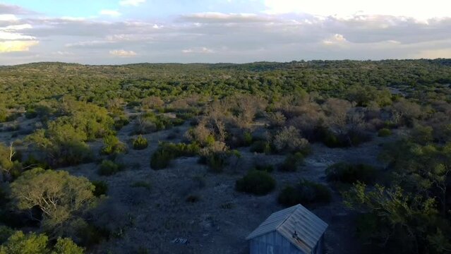 Aerial video of South Llano River State Park full of mountains, Junction, TX