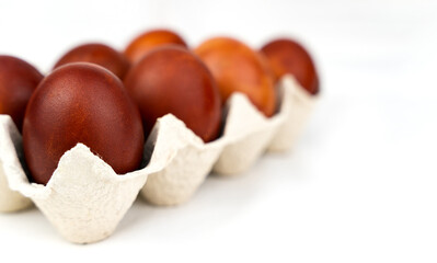 Easter red eggs on a white background. Happy Easter. Close-up. Copy space. Selective focus.