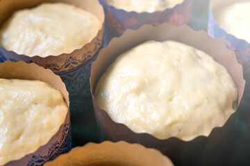 Sour dough for Easter baking in the paper form. Homemade cakes for Easter. Close-up. Selective focus.