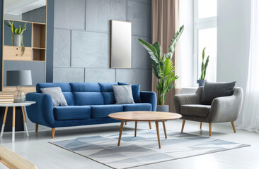 Modern living room with a blue sofa and armchair near a geometric carpet on a gray wall, white furniture in a bright interior of a modern home