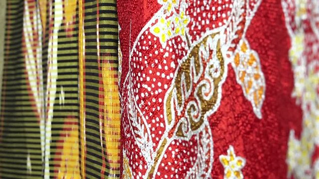 Batik Jember Indonesia, makes traditional batik clothes from East Java, Indonesia. neatly hung for sale.