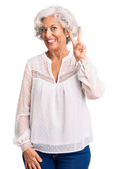 Senior grey-haired woman wearing casual clothes showing and pointing up with fingers number two while smiling confident and happy.