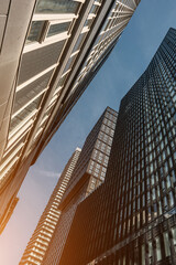 tall skyscrapers buildings looking up perspective, modern architecture of steel and glass, skyline of big city