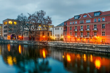 Berlin, Germany, March 9, 2024: various old and new buildings on the northern bank of the river...