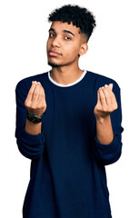 Young african american man wearing casual clothes doing money gesture with hands, asking for salary...