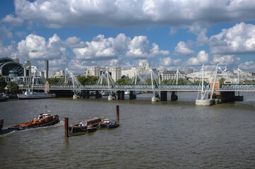 Hungerford Bridge and Golden Jubilee Bridges and Charing Cross station seen from London Eye In London, UK