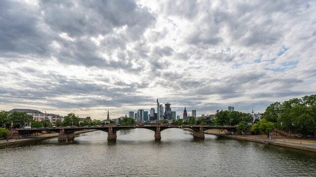 Ignatz Bubis Bridge over River Main against the cloudy sky at Frankfurt, Germany