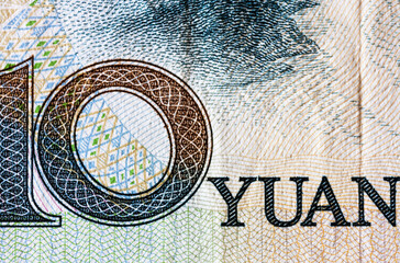 Close-up of fragment Chinese ten yuan paper note. Сoncept of money, finance, international Asian cooperation, Chinese currency exchange rate and trade. Flat lay, macro, top view, mock up