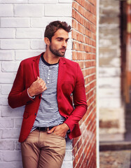 Man, think and fashion in urban wall or outdoor with outfit for casual or office wear for trends...