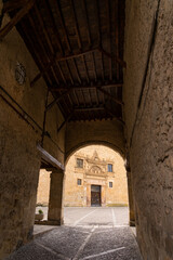 Fototapeta premium Mayor square arch in the medieval village of Peñaranda de Duero at sunset, Burgos, Spain.