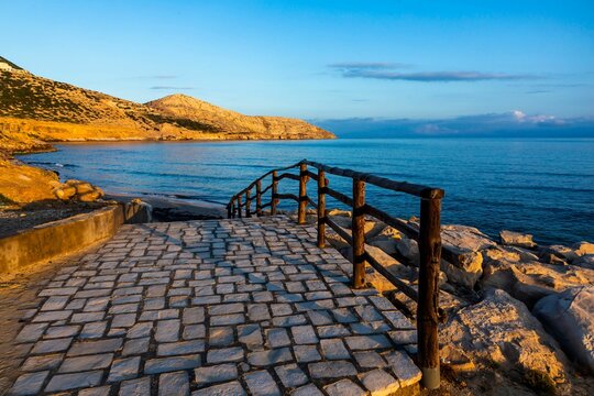 Idyllic landscape of stairs leading up to a sunrise over the Mediterranean Sea in Bizerte, Tunisia
