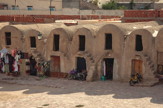 Souvenir stands in Ghorfas of Medenine. old granaries in historic fortified village called Ksar, Medenine city, Tunisia