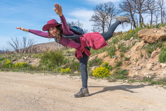 Hiker Perfecting Airplane Yoga Pose Outdoors