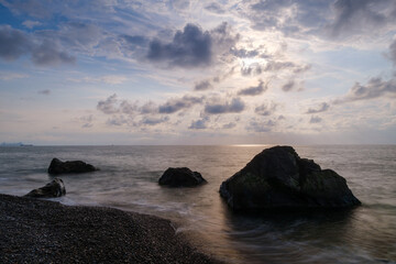 Obraz premium Water waves of the Black Sea crashing on rocks on the stony shore, coast - close up, nobody, no people. Nature, element, landscape