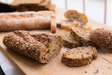 Fresh loaf of bread on wooden board