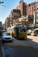 14 06 2023 Alexandria, Egypt, the streets of an ancient African city filled with people and trams....