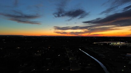 Fototapeta na wymiar Stunning aerial view of a city skyline illuminated by a beautiful sunset