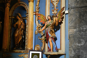 Statue of an angel in the Collegiate Church of Our Lady and Saint Nicholas of BrianÃ§on in the fortified old town built by Vauban in the French Alps - obrazy, fototapety, plakaty