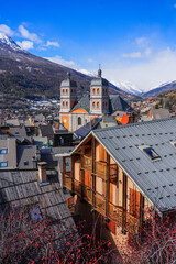 Aerial view of the Collegiate Church of Our Lady and Saint Nicholas of Briançon in the fortified old town built by Vauban in the French Alps - obrazy, fototapety, plakaty