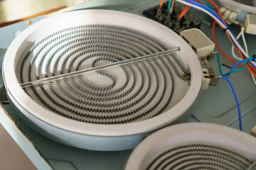 stove repair in the kitchen . The induction hob needs repair, the heating element is burnt out.