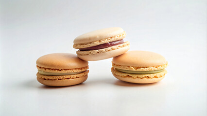 Fototapeta premium Colorful French macaroons arranged on a white background
