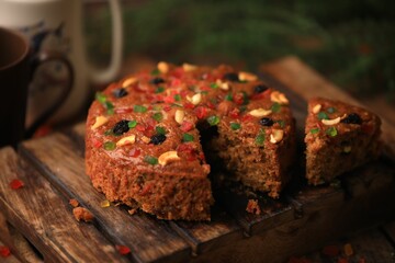 Christmas cake ,plum cake served on a table closeup with selective focus and blur