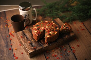 Christmas cake ,plum cake served on a table closeup with selective focus and blur