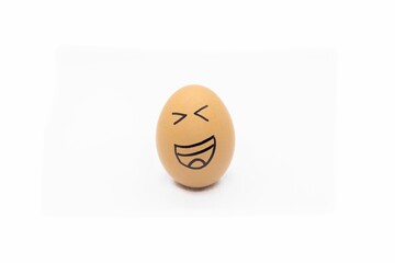 an egg with a smiley face drawn on it's side