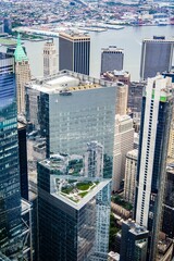 Aerial view of a bustling cityscape with towering skyscrapers and high-rise buildings