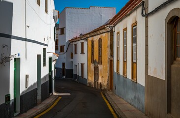 Empty Tenerife street with residential buildings on each side