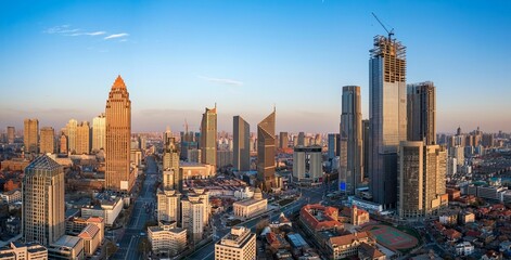 Aerial shot of urban buildings, tourist attractions and landmarks in Tianjin, China at sunset