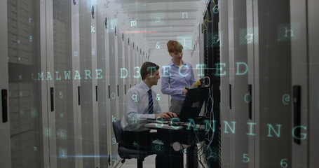 Fototapeta premium Cyber security data processing over caucasian male and female engineer working at server room