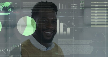 Statistical data processing over portrait of african american man smiling at office