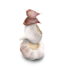 Stacked heads and cloves of garlic on beige background