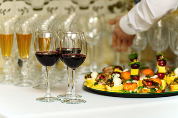 A table for welcoming guests to a party with drinks and snacks