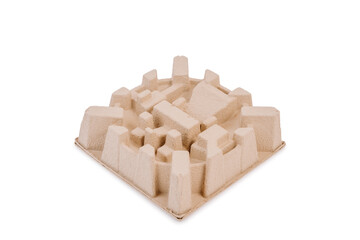 A beige cardboard holder with a central circular recess and multiple surrounding protrusions for...