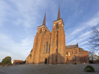 Roskilde Cathedral in Denmark during sunset with almost no people