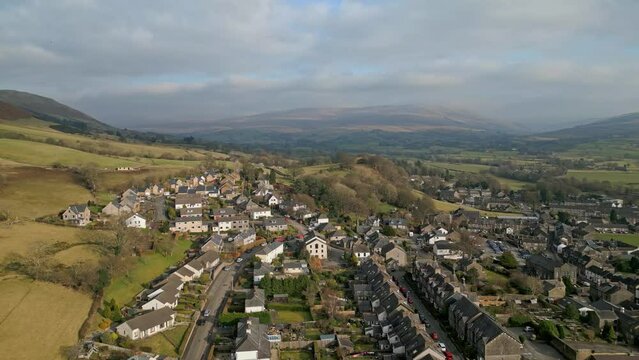 Drone view of Sedbergh town with old rural houses and green landscape