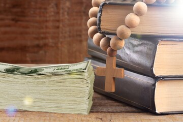 Holy Bible book and money in church.