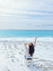 Young woman relaxing on the beach.