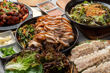 Korean food, pig's feet, pork, bossam, lettuce, perilla leaves, spicy, garlic, pepper, salted shrimp,