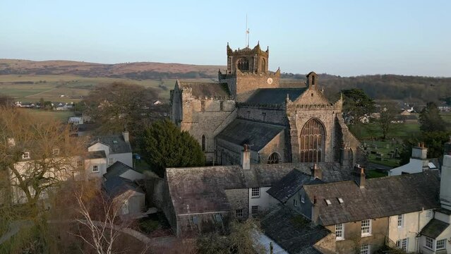 Aerial video of an old Cathedral in St Davids, Wales on a sunny day