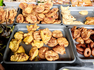 Various kinds of takjil for breaking fast. Snacks on display.