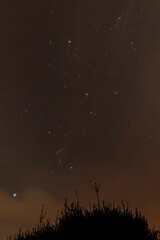 the night sky with many lights on is dark and filled