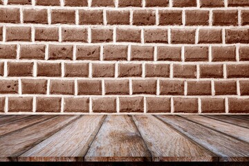 a wooden surface and a brick wall in sepia tone